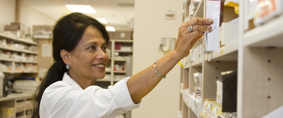 Our pharmacy team dispensing medicines at Barons Court Pharmacy, 3 Margravine Gardens, Barons Court, Hammersmith, London W6 8RL